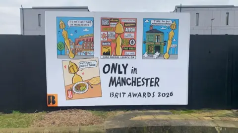 More Brit Awards artwork on a poster in Manchester 