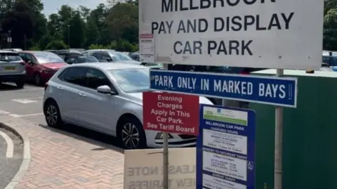 Surrey council signs at a pay and display car park in Surrey