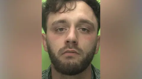 Nottinghamshire Police Tyler Reilly mugshot against a green background