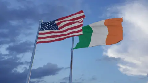 Getty The national flag of the Republic of Ireland and the national flag of the United States fly side-by-side on flagpoles.