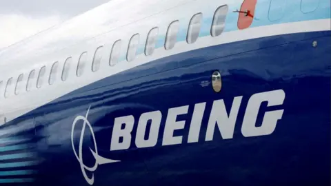 Reuters Boeing name and logo seen on the side of a plane