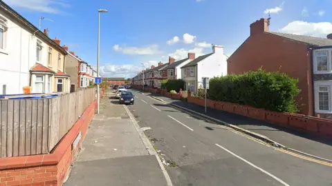 Google Chesterfield Road in Blackpool - a residential street with semi-detached houses on each side. There are some cars parked on the pavement.