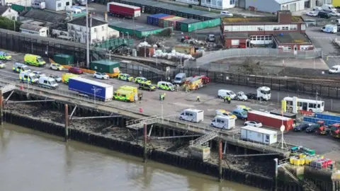 Eddie Mitchell An aerial shot showing emergency service crews at the port