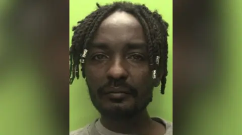 A mugshot of Omran Ahmed 