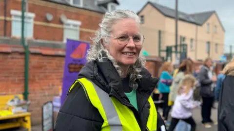 Kellie Turtle in black coat with hi-viz jacket