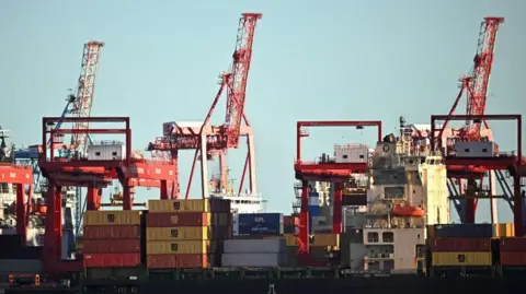 Getty Images Cranes and containers at Liverpool freeport