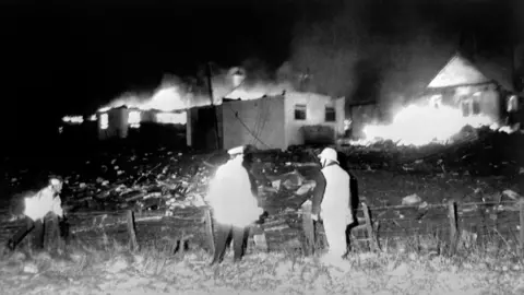 PA Media Houses on fire following the blowing up of Pan Am flight 103 over Lockerbie, December 21st 1988