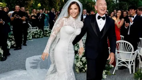 Instagram/Reuters Bezos and Sanchez arrive at their wedding in Venice, surrounded by guests.