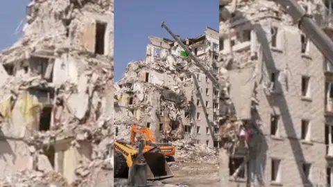 The aftermath of a block of flats in Kyiv after Russian strikes