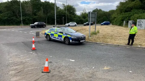 BBC A police block on a roundabout