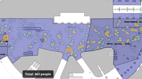 Createc A screenshot of the technology developed by Createc. It shows the layout of King's Cross station with a live heatmap of dots on the map, which are the people at the station. The dots are yellow, with a pale glow of yellowy-green around them, against a purple, white and grey background depicting the different areas of the station. Where a number of dots cluster together the glow edges towards red.