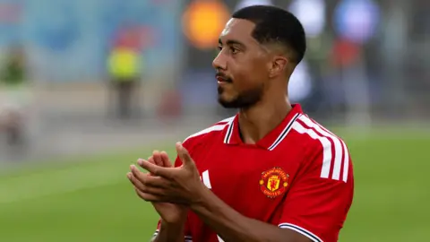 Youri Tielemans applauding fans