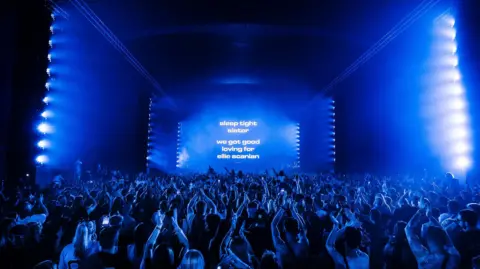 Josef Hall Crowd watching a DJ perform.