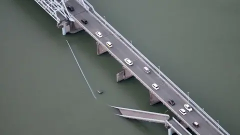 Reuters An aerial view shows a collapsed bridge due to an earthquake in Yatsushiro City, Kumamoto prefecture, south-western Japan. Photo: 28 July 2026