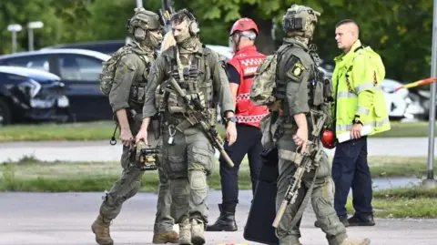 EPA Armed police officers at the scene of the Sweden school shooting