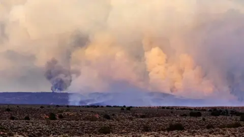 Picture of smoke rising over the mountains at Arizona fire