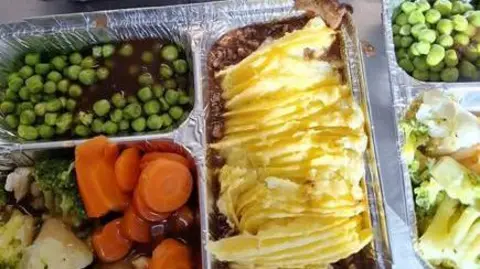 Bus Park Community Hub Hot traditional dinner served on a silver foil tray