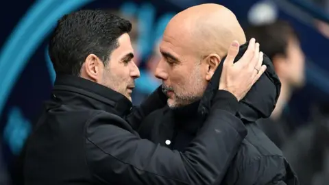 Arteta and Guardiola embrace