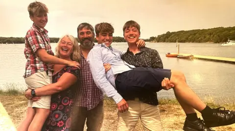 Becs Wadley A smiling family photo of Becs and Tony Wadley with their three sons Felix, Freddie and Elliott 