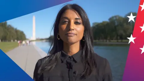 Sumi Somaskanda standing in front of the Washington monument