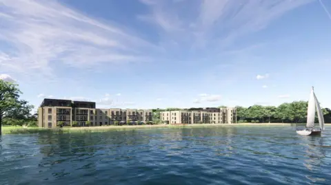 Gladman Retirement Living Ltd Several three-storey buildings are situated on grass next to a lake where a small white boat is on the left. The buildings in the background have balconies. Several trees are dotted around the complex.