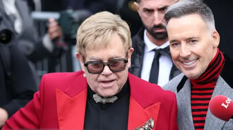 Getty Images Elton John and David Furnish attend Valentino during Haute Couture Spring Summer 2026 a