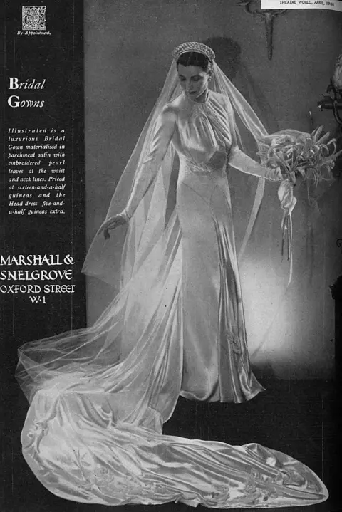 Getty Images Advertisement for luxurious Bridal Gown of parchment satin with embroidered pearl leaves at waist and neck lines 