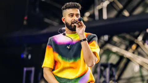Getty Images  AP Dhillon performs at the Sahara Stage at the 2024 Coachella Valley Music And Arts Festival weekend 1 day 3 at Empire Polo Club on April 14, 2024 in Indio, California