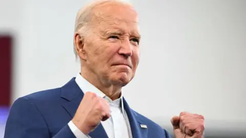 Getty Images Joe Biden raises his fist in Detroit, Michigan, on July 12, 2024