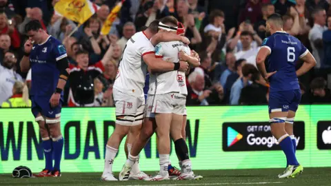 Ulster players celebrate at the final whistle