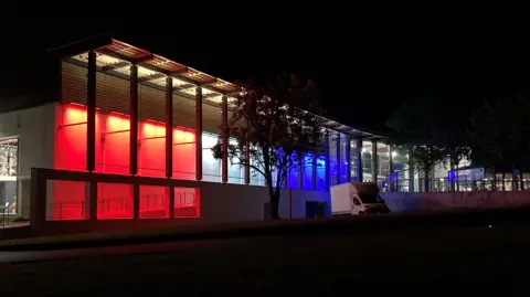 Beau Sejour Leisure Centre lit up in red, white and blue