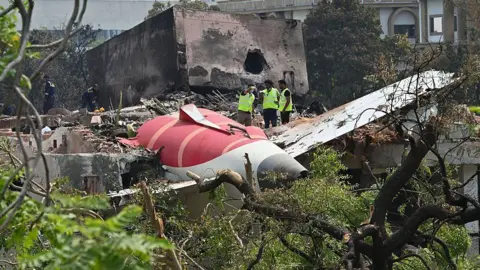 Getty Images Forensic experts and DGCA officials searching for evidence at Air India Plane crash site, on June 13, 2025 in Ahmedabad, India. The Air India flight, which was bound for London, crashed shortly after taking off from Ahmedabad Airport. Around 260 people lost their lives in the incident.