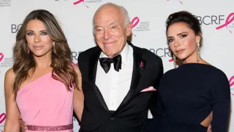 Elizabeth Hurley, Leonard Lauder and Victoria Beckham attend the 2017 Breast Cancer Research Foundation Hot Pink Party at Park Avenue Armory on May 12, 2017 in New York City.