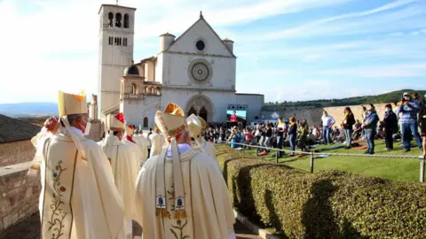 Getty Images Cardinals, bishops, friars and priests walk to the St. Francis Basilica for the beatification ceremony of Carlo Acutis at on October 10, 2020 in Assisi, Italy. 