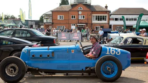 A 1934 Frazer Nash Norris Special - a small blue, open-top car with driver Julian Grimwade on at Brooklands Racing Circuit on June 18th, 2017 in Weybridge, England.