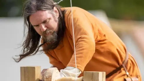 Great Ousekjarr Viking Society Viking re-enactor working a lathe