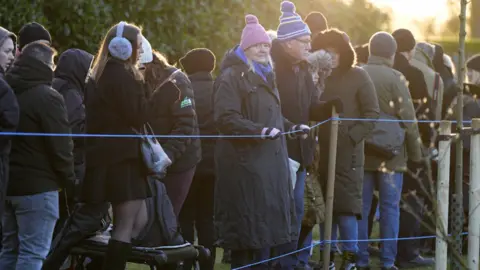 PA Media Members of the public at the Christmas Day morning church service which will be attended by members of the Royal Family in Sandringham