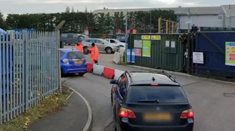 Google Residents arriving at a recycling centre