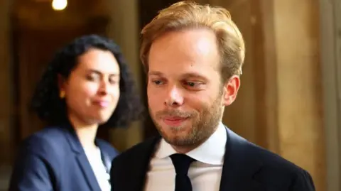 Member of parliament Charles Alloncle, from the UDR (Union des Droites pour la Republique) party and rapporteur of the Commission of Inquiry on Public Broadcasting. He is wearing a dark suit. 