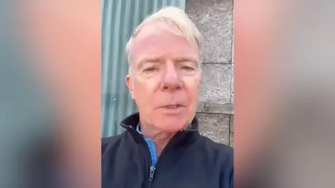 Older man in blue clothes