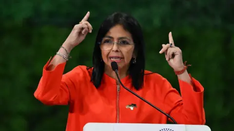 AFP via Getty Images Venezuela's Vice President Delcy Rodriguez speaks during the Antifascist Global Parliamentary Forum in Caracas on November 5, 2024. (Photo by Juan BARRETO / AFP) (Photo by JUAN BARRETO/AFP via Getty Images)