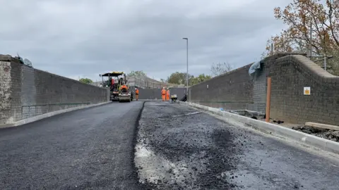 Network Rail The road being resurfaced