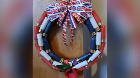 AFCF / FREEDOM OF INFORMATION A wreath in red white and blue colours with a Union Flag ribbon