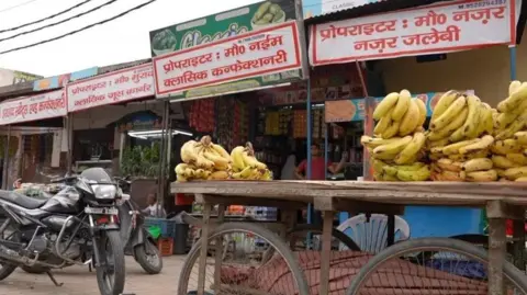 Getty Images Names of Muslim owners displayed on signboards outside shops in Muzaffarnagar