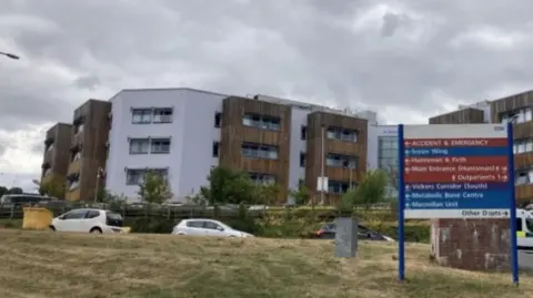 The outside of Sheffield's Northern General Hospital with hospital signs