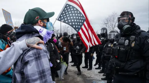 Minneapolis Police Department officers face off with protesters during an anti-ICE protest outside of the Whipple Federal Building in Fort Snelling, Minnesota, USA, 15 January 2026. 