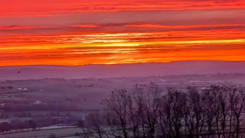 Kiera Needs A Walk/Weather Watchers Orange sky captured in Herefordshire