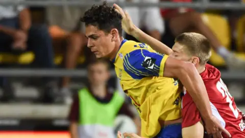 Yousef Salech (left) holds off an opponent