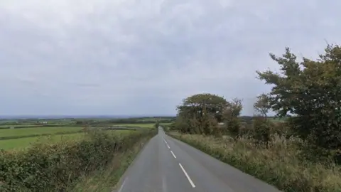A view of a road and fields