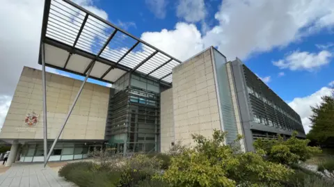 Steve Hubbard/BBC exterior of South Cambs District Council offices taken from a low angle and showing a pale brick building with iron struts